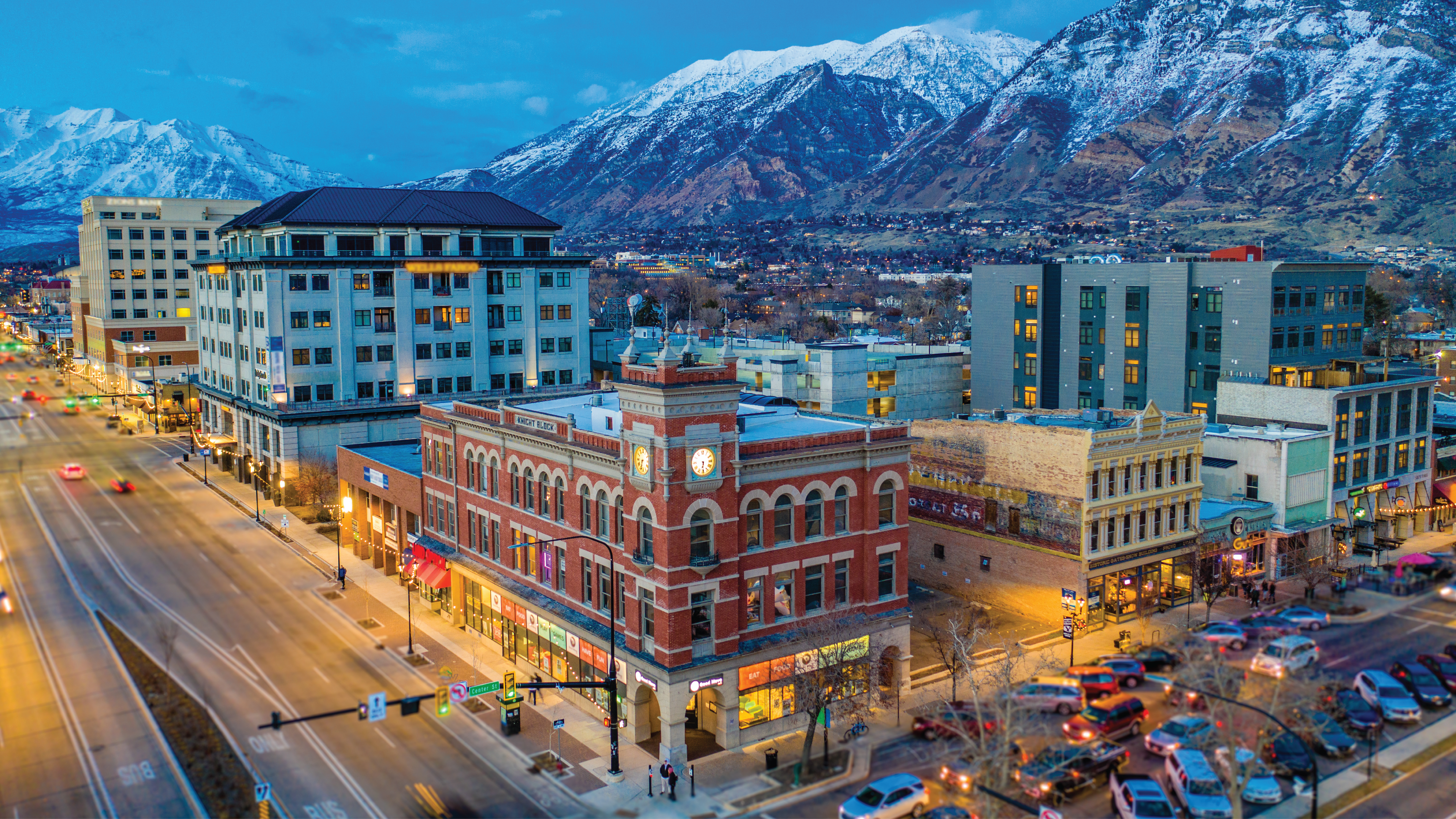 Evening photo with downtown Provo, UT set against snowcapped mountains